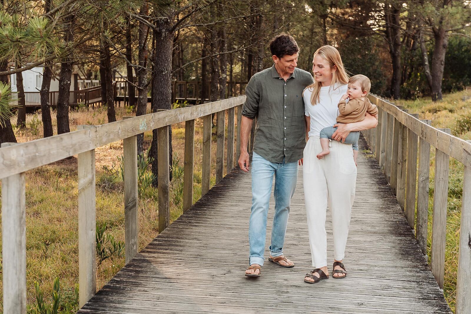 Family walking on the beach bridge