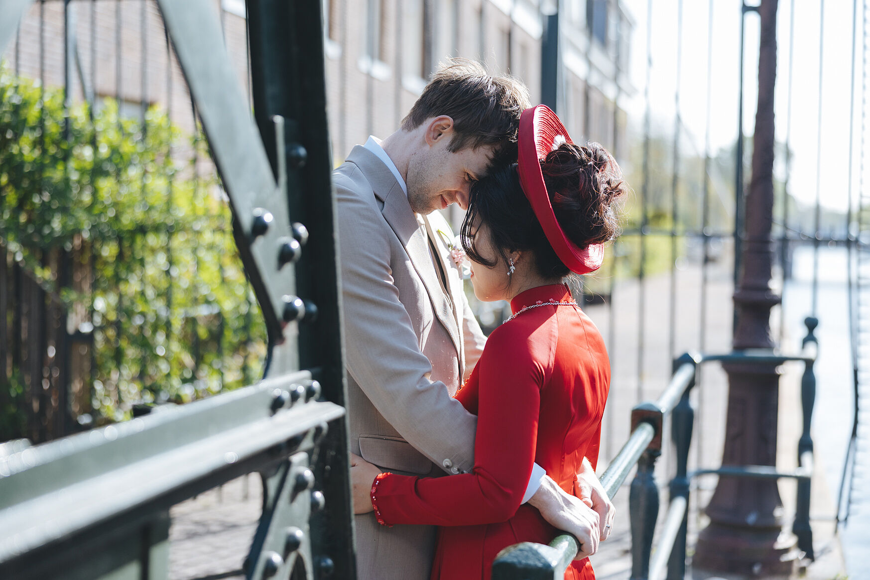 Wedding in Amsterdam, portrait of the bride and groom by the canal. 