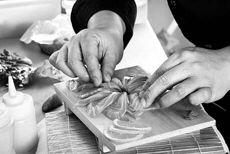 Preparing fresh salmon sahimi copia